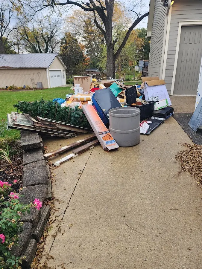Dumpster being loaded with debris for 30 Yard Dumpster Rental in Kettering